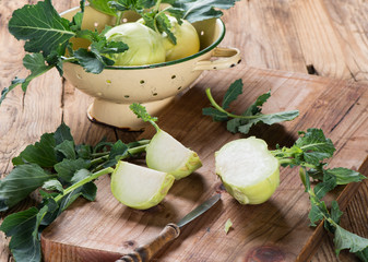 Kohlrabi cabbage on dark wooden