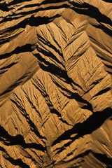 Obraz na płótnie Canvas Mountain range from airplane jagged edges brown