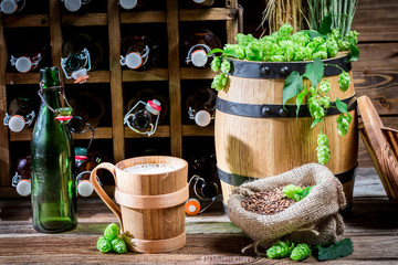 Beer served in a wooden mug in the cellar