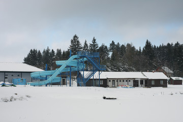 Fototapeta na wymiar Abandoned aquapark in winter