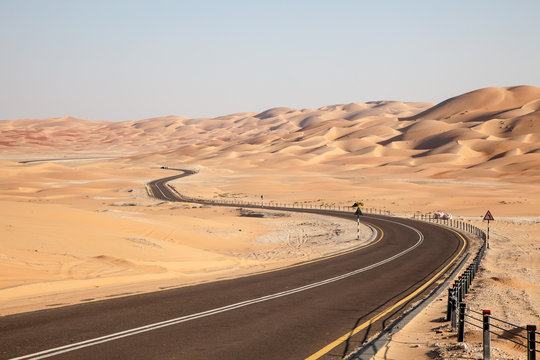 Road through desert in Liwa Oasis, Abu Dhabi, UAE