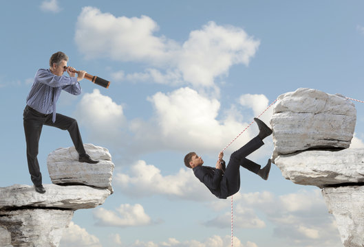 Businessman looks through a telescope - Powered by Adobe