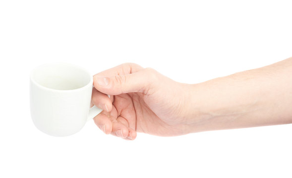 Hand holding ceramic coffee cup
