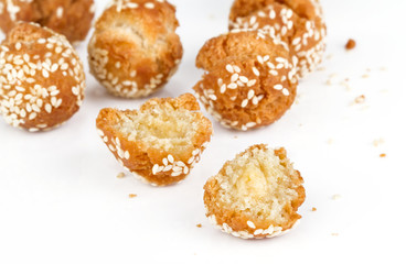 cracked donut ball with white sesame on white background