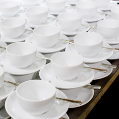 Many rows of pure white cup and saucer designed in vintage retro