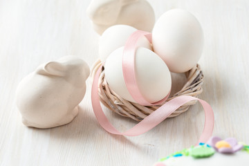 Easter eggs with pink ribbon