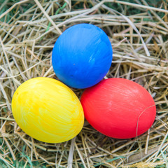 Fototapeta na wymiar Colored easter eggs in basket
