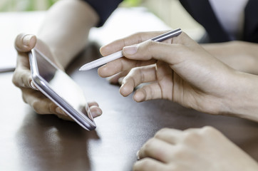 women using tablet with stylus pen