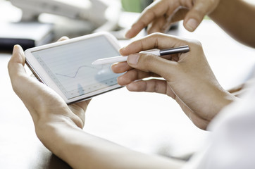 women using tablet with stylus pen
