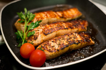 Fresh salmon filles  grilled in a pan