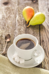 coffee cup black wooden board brown pears white