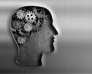 Brain model from gears and cogs in metal plate.