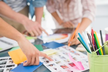 Teamwork briefing and editing photos together