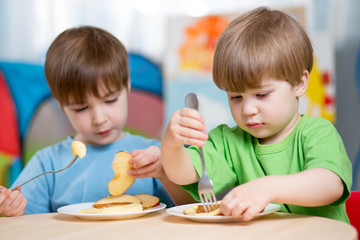 children eating healthy food at home