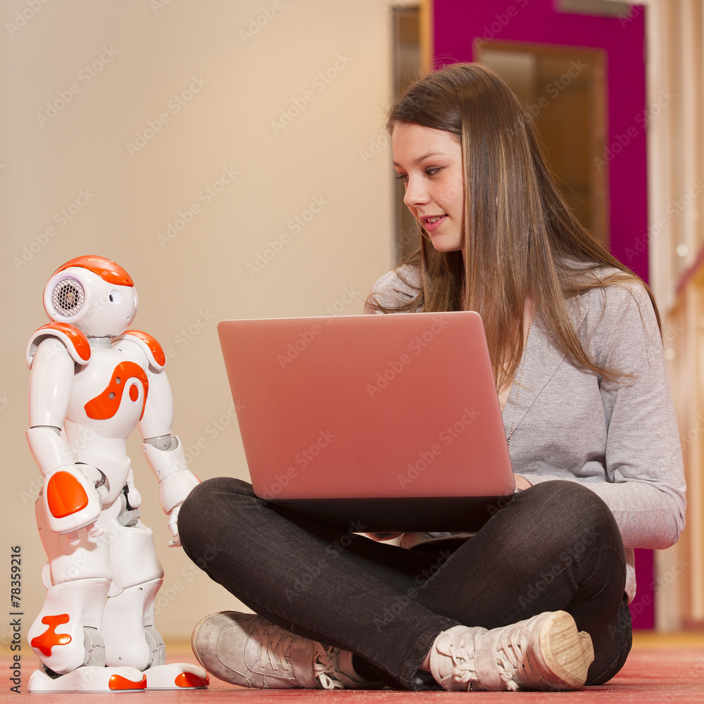 Wall mural child playing and learning with robot