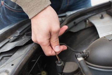 Man checking the engine of his car