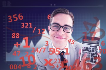 Composite image of geeky smiling businessman showing calculator