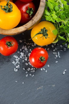 Farm fresh tomatoes with fresh basil herb and rock salt