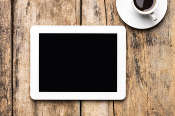 Tablet PC on wood background