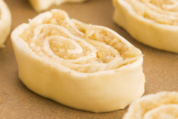 Puff pastry cookies with apple and cinnamon before baking