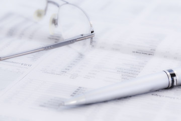 Business newspaper and glasses