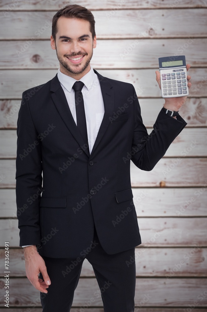 Poster composite image of smiling businessman presenting a calculator