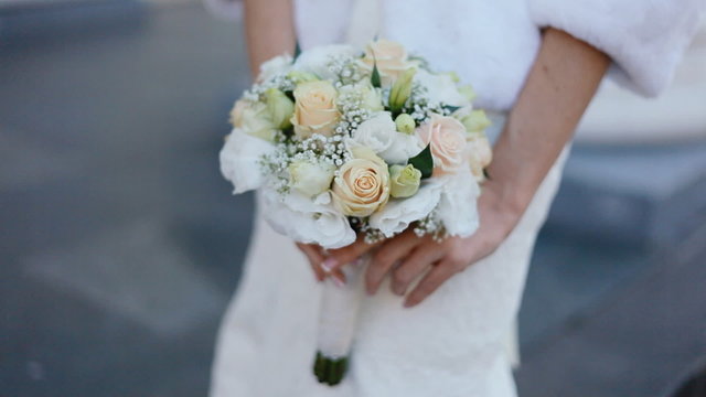 Young woman hold bouquet in her hands