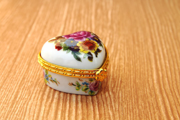 heart jewelry box on wooden bg