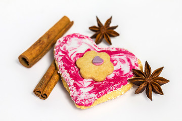 Heart shaped cookie decorated with cinnamon and star anise