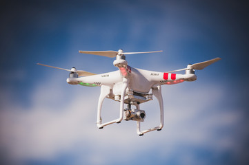 flying drone with camera on the sky - obrazy, fototapety, plakaty