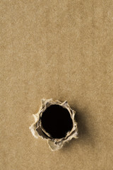 black hole in cardboard