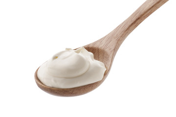 cream in spoon isolated