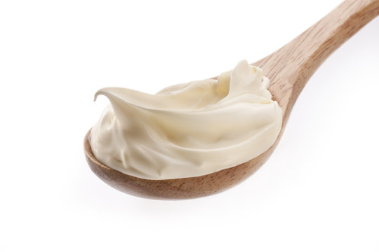 cream in spoon isolated