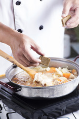 Chef putting Japanese curry paste for cooking