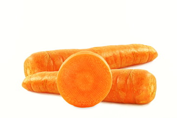 carrot with slice closeup in pure white background