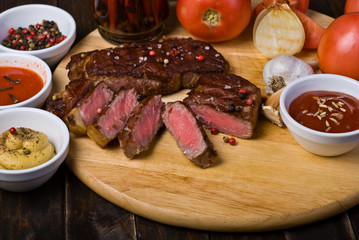Beef Steaks with Sauces, French Fries and Vegetables