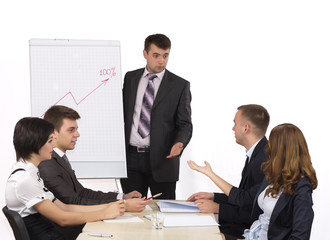 Energetic corporate manager instructs his team