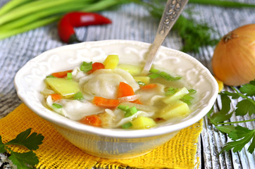 Vegetable soup with pelmeni.