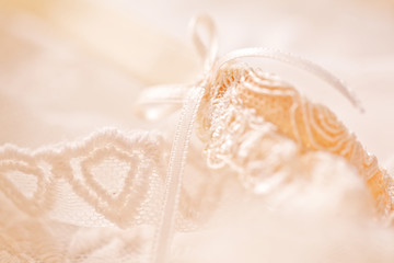 Tenderness peachys lingerie with candle and motif. Love mood.
