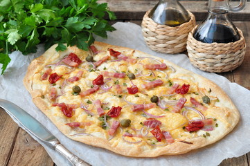 French traditional dish tarte Flambee with onion and ham