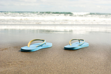 Fototapeta na wymiar summer shoes on sand