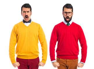 Twin brothers with moustache shouting