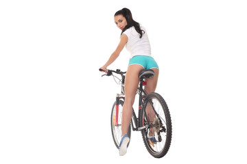 Fototapeta premium sexy girl with a bike on a white background