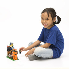 Cute little girl playing with blocks toy - 78380478