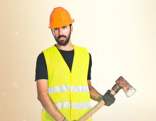 Workman with ax over white background