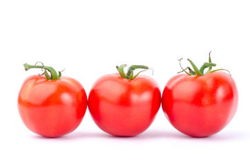 Fresh tomatoes on white background
