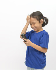 Cute little girl laughing while looking to the telephone