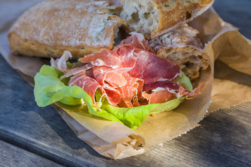 outdoor snack of bread and smoked meat