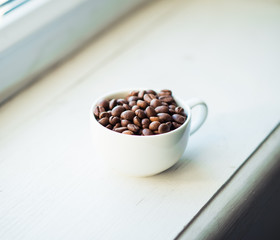 coffee cup and beans, cinnamon sticks
