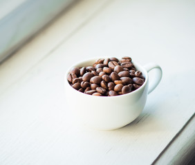 coffee cup and beans, cinnamon sticks